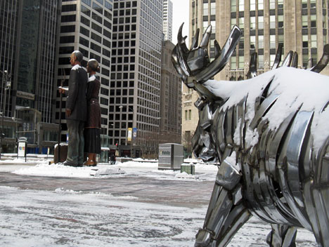 Moose, sculpture by John Kearney, comtemplates God Bless America, sculpture by J. Seward Johnson, on Pioneer Court, Chicago
