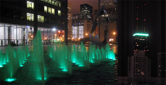 The green fountain of Daley Plaza and green crest of the Hancock Building honor St. Patrick's day